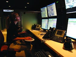 A Westec intervention specialist in the company&rsquo;s central command center talks to one of their locations across the country. Image courtesy Westec