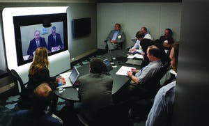 In a teleconference from ADT&apos;s Integrated Solutions Center in Colorado, (from left on screen) ADT Director of Integrated Strategy Jim Lantrip and Cisco Physical Security Business Unit Vice President Bill Stuntz address security media members gathered in Chicago for the ADT Media Summit.