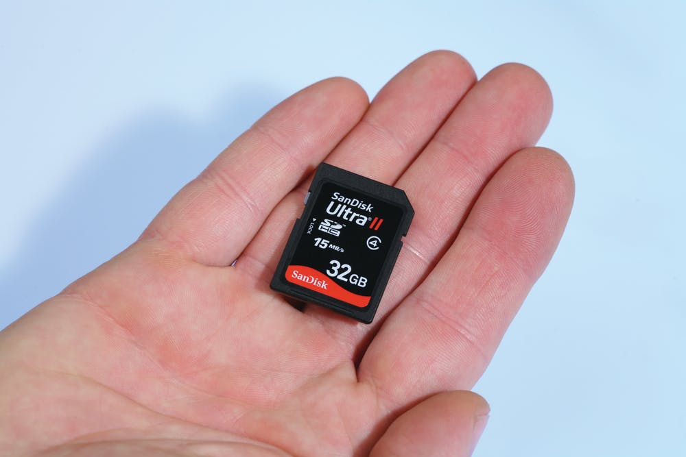 SD cards are typically the size of a postage stamp and fit into a card slot inside supported cameras.