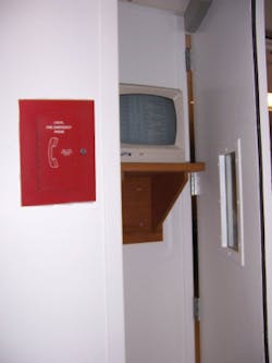 This is an example of a hospital&apos;s Private Mode textual visible notification appliance (CRT) which is located in a service corridor behind doors and out of site from the public. The voice communication system (left) will be used by the fire department to discuss the annunciated conditions as they occur in real time.