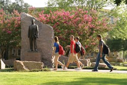 Students traverse the concourse at Texas A&M University Students traverse the concourse at Texas A&M University