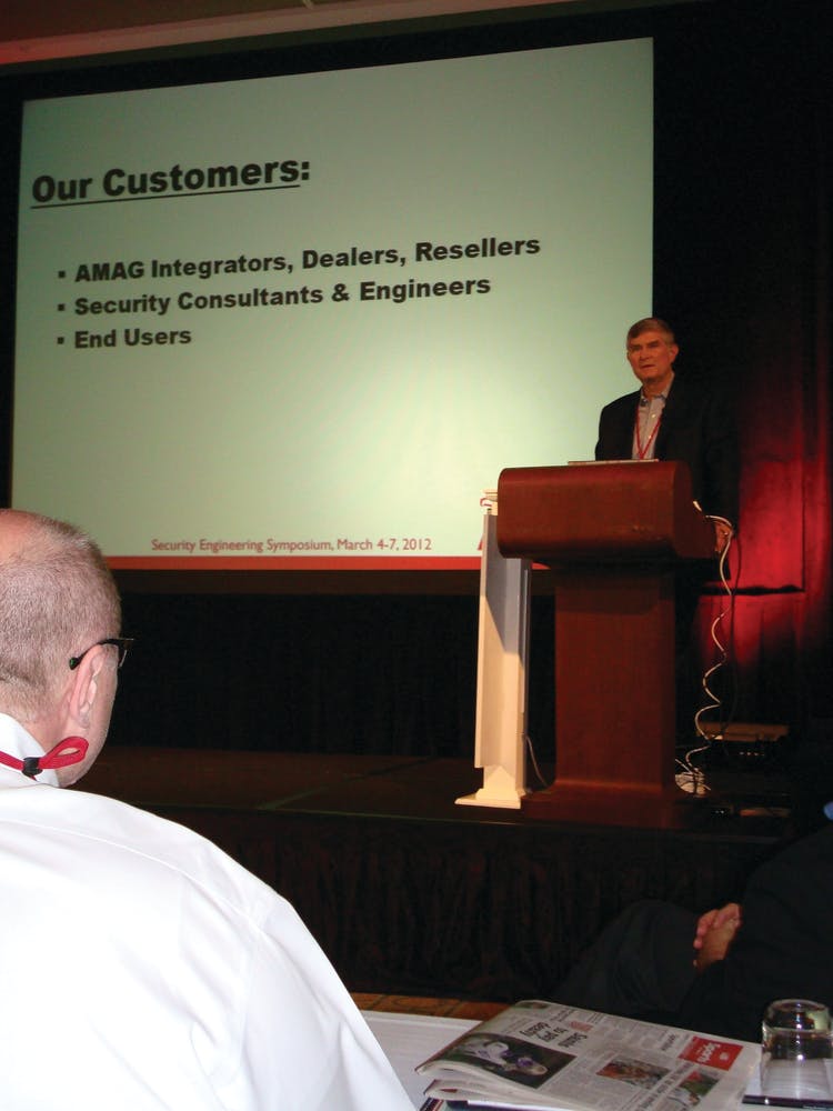 Robert Sawyer, president of AMAG Technology Inc., Torrance, Calif., addresses attendees at the 11th Annual Engineering Symposium in Florida this week.