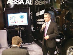 Assa Abloy Executive Vice President and Chief Operating Officer Martin Huddart addresses the audience at Wednesday&apos;s press conference.