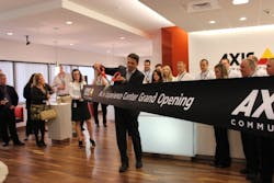 Axis General Manager Fredrik Nilsson cuts the ribbon at the company&apos;s new North American headquarters.