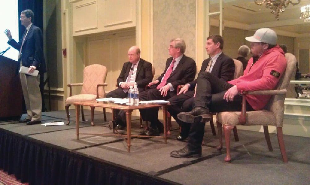 A panel addresses the crowd on Friday, Feb. 10, 2012, during the Barnes Buchanan Conference, a financial conference for the alarm industry.