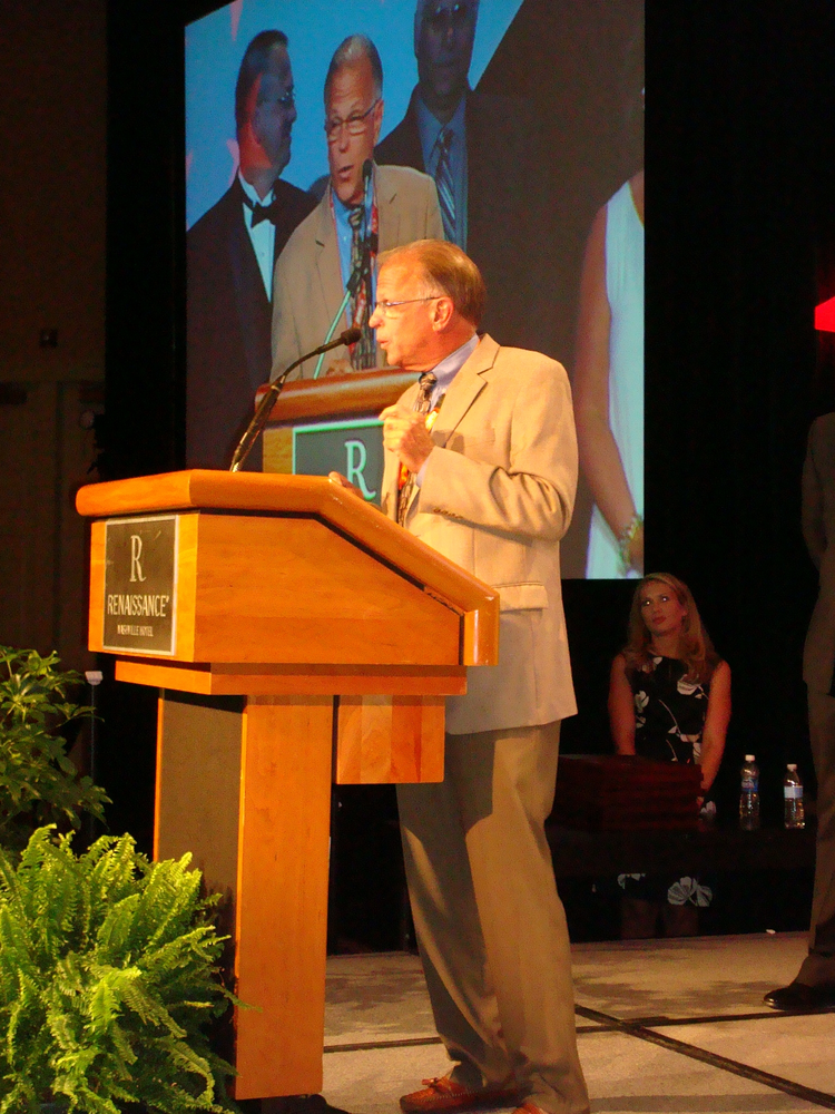 Dan Budinoff, president and owner of Security Specialists in Stamford, Conn., accepts his accolade as the Morris F. Weinstock Person of the Year at an awards ceremony during ESX 2012 in Nashville.