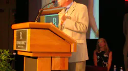 Dan Budinoff, president and owner of Security Specialists in Stamford, Conn., accepts his accolade as the Morris F. Weinstock Person of the Year at an awards ceremony during ESX 2012 in Nashville.