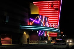 Police are pictured outside of a Century 16 movie theatre where as many as 14 people were killed and many injured at a shooting during the showing of a movie at the in Aurora, Colo., Friday, July 20, 2012. (AP Photo/Ed Andrieski)
