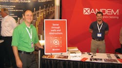 Dr. Joey Wilson (left) stands in front of the Xandem booth at ASIS 2012. The company is showcasing its Tomographic Motion Detection at the show this week.