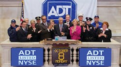 Members of ADT&apos;s senior leadership team ring the opening bell at the New York Stock Exchange on Monday, Oct. 8, 2012.