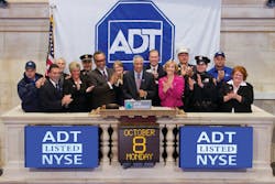 Members of ADT's senior leadership team ring the opening bell at the New York Stock Exchange on Monday, Oct. 8, 2012. Members of ADT's senior leadership team ring the opening bell at the New York Stock Exchange on Monday, Oct. 8, 2012.