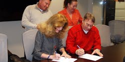 AFGE TSA Council 100 Executive Vice President Al Jackimowitz and TSA Partnership Office Director sign the new collective bargaining agreement as Council Secretary-Treasurer Dean Johnson and Council Regional Vice President 1 Stacy Bodtman look on. AFGE TSA Council 100 Executive Vice President Al Jackimowitz and TSA Partnership Office Director sign the new collective bargaining agreement as Council Secretary-Treasurer Dean Johnson and Council Regional Vice President 1 Stacy Bodtman look on.