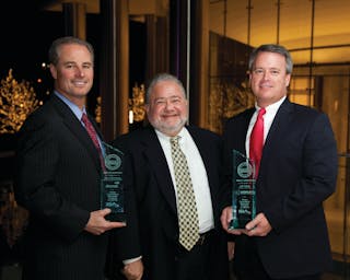 Devon Energy Security Director Kent Chrisman (left) and Jeff Fields, General Manager of integrator Dowley Security Systems (right), accept the 2012 STE Security Innovation Awards gold medal from Editorial Director Steve Lasky (middle).