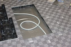 This photo, taken during a recent installation, shows how cables are managed underneath the PowerFlor. This photo, taken during a recent installation, shows how cables are managed underneath the PowerFlor.