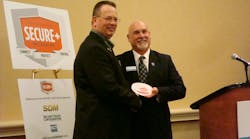 Mike Miller of Moon Security receives a SECURE+ award from Kirk MacDowell, residential business leader, Interlogix and SECURE+Task Force Chair.