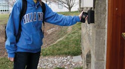 A student at Villanova University in Philadelphia waves her smartphone at the reader to gain secure admittance to her building.