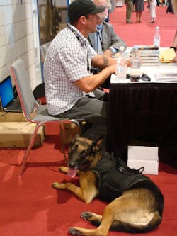 Mike Ritland of the Warrior Dog Foundation with former service dog Rico by his side.