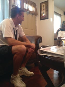 Tim Whall, CEO of Protection 1, visits with a homeowner during the summer sales initiative.