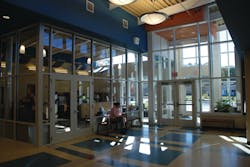 Many schools have an entrance vestibule — usually a glass enclosed area with locked doors — that directs visitors to the main office. Many schools have an entrance vestibule — usually a glass enclosed area with locked doors — that directs visitors to the main office.