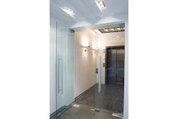 The Securitron R100 Surface Mounted Wireless Reader offers an elegant way to extend access control to glass, stone, granite or marble entryways. The R100 uses wireless communication between the reader and an Aperio® hub to connect to the access control system. Installation of the R100 is simple and convenient, requiring no drilling or pulling of wires to the door and can be adhered to the outside of a glass door in a few minutes. The Securitron R100 Surface Mounted Wireless Reader offers an elegant way to extend access control to glass, stone, granite or marble entryways. The R100 uses wireless communication between the reader and an Aperio® hub to connect to the access control system. Installation of the R100 is simple and convenient, requiring no drilling or pulling of wires to the door and can be adhered to the outside of a glass door in a few minutes.