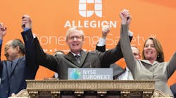 Dave Petratis (center) and other Allegion executies celebrate the ringing of the opening bell at the NYSE.