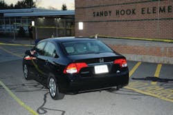 This photo released last month in the long-anticpated report on the Sandy Hook Elementary School shooting shows the car of shooter Adam Lanza parked outside the school.
