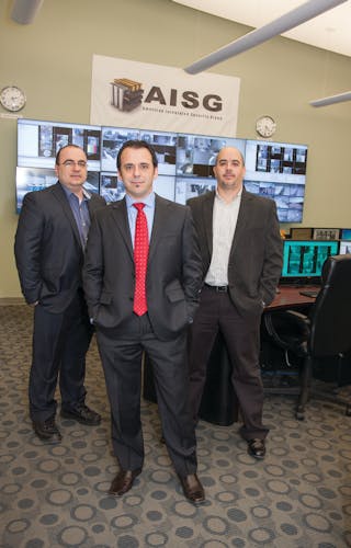 AISG President and CTO Levi Acs (front) is flanked by Arnold Koble, VP engineering (left) and Rocco Lipari, national operations director (right), inside the company&apos;s central monitoring facility.