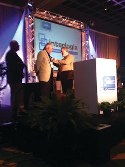 Weinstock Person of the Year recipient Charles Dom D’Ascoli (left) receives a pin from 2013 winner David Koenig. Weinstock Person of the Year recipient Charles Dom D’Ascoli (left) receives a pin from 2013 winner David Koenig.