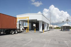 A cargo truck prepares to enter the Decision Sciences&rsquo; multi-mode passive detection system. The company&rsquo;s scanning technology cosmic ray charge particles to determine the density of objects within cargo containers.