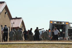 First responders prepare to move victims wounded during the first mass shooting at Fort Hood in November 2009.