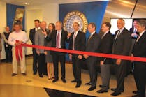 Tyco executives prepare to cut the ribbon at the company&apos;s newly expanded Global Center of Excellence on Monday in Birmingham, Ala.