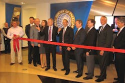 Tyco executives prepare to cut the ribbon at the company's newly expanded Global Center of Excellence on Monday in Birmingham, Ala. Tyco executives prepare to cut the ribbon at the company's newly expanded Global Center of Excellence on Monday in Birmingham, Ala.