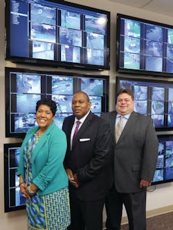 The HACP security team gathers in front of the video wall in the command and control center. Joy Pekar-Miller, Director of Public Security (left), Caster Binion, Executive Director (middle), and Edward Mauk, CFO (far right) The HACP security team gathers in front of the video wall in the command and control center. Joy Pekar-Miller, Director of Public Security (left), Caster Binion, Executive Director (middle), and Edward Mauk, CFO (far right)