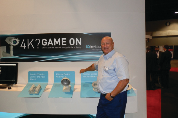 New Vicon CEO Eric Fullerton stands at the IQinVision booth at ASIS 2014 conference on Monday, Sept. 29.