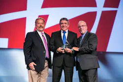 From left to right: Larry Newman, director of sales, Axis Communications; Michael Flink, president, ADI Americas; Scott Dunn, director of business development, Axis Communications. From left to right: Larry Newman, director of sales, Axis Communications; Michael Flink, president, ADI Americas; Scott Dunn, director of business development, Axis Communications.