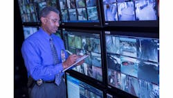 Navicent Police Chief Quentin Jude takes notes as he assesse real-time video surveillance in the command center. Navicent Police Chief Quentin Jude takes notes as he assesse real-time video surveillance in the command center.