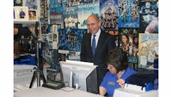 University of Kentucky President Eli Capilouto reviewis his new ID with adminstrator Karen Doyle. University of Kentucky President Eli Capilouto reviewis his new ID with adminstrator Karen Doyle.