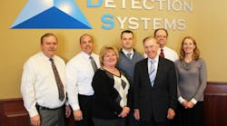 From l-r: Rick Raper, VP Central Station Services; Ken Mish, VP Alarm Service and Call Center Ops; Peggy Raper, Call Center Manager; Nick Bonifas, Corporate Counsel; Bob Bonifas, Owner/CEO; Mark Schramm, VP and CIO, and Amy Becker, VP and controller.