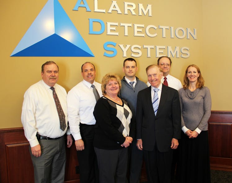 From l-r: Rick Raper, VP Central Station Services; Ken Mish, VP Alarm Service and Call Center Ops; Peggy Raper, Call Center Manager; Nick Bonifas, Corporate Counsel; Bob Bonifas, Owner/CEO; Mark Schramm, VP and CIO, and Amy Becker, VP and controller.