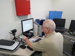 FPS director Floyd Jennings works with the integrated video/access control system. FPS director Floyd Jennings works with the integrated video/access control system.