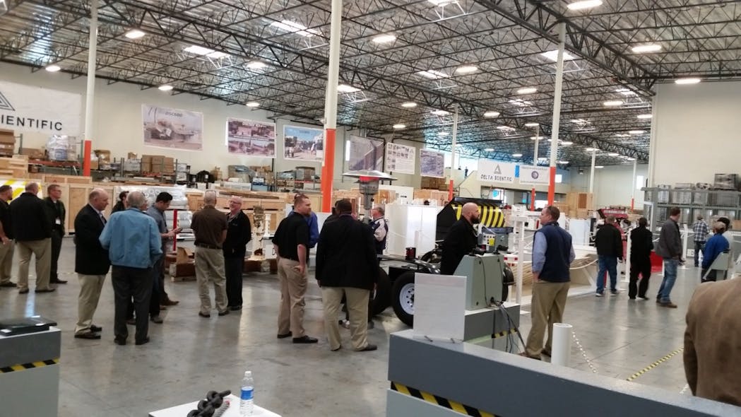 Attendees at Delta's vehicle access equipment demonstration ask for