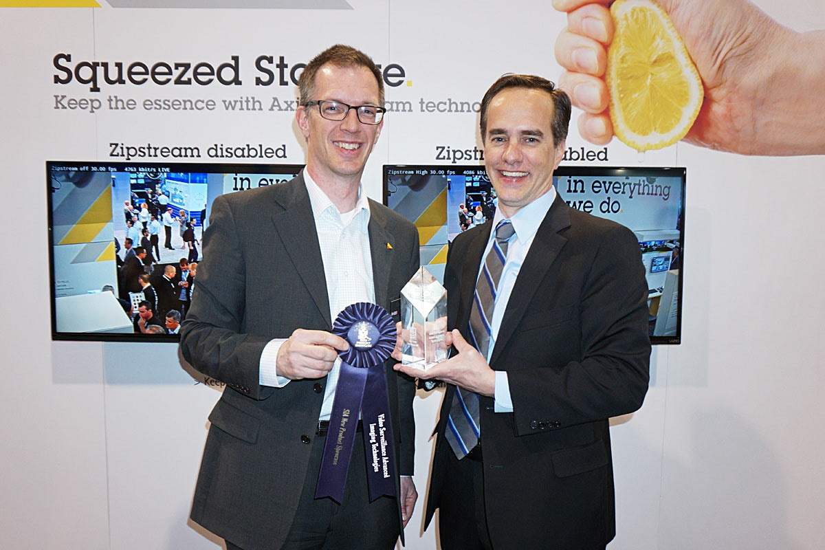 Stefan Lundberg (left), expert technologies engineer, and James Marcella (right), director of technical services, accepted the SIA New Product Showcase award for Axis&rsquo; Zipstream technology April 15 at ISC West.