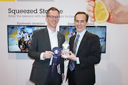 Stefan Lundberg (left), expert technologies engineer, and James Marcella (right), director of technical services, accepted the SIA New Product Showcase award for Axis&rsquo; Zipstream technology April 15 at ISC West.