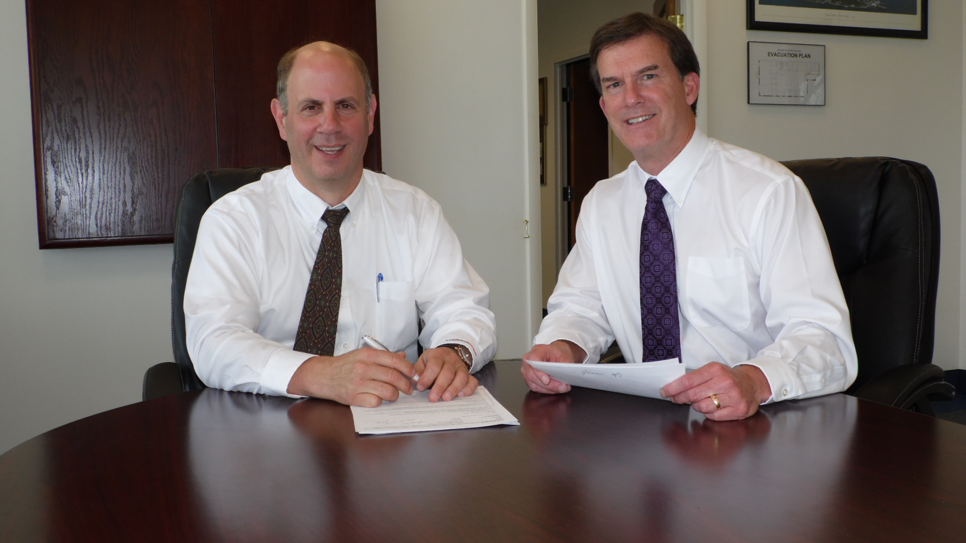 Michael S. Rogers, left, and Dan Prochnow rely on partners to help them fulfill many of the contracts they land with the federal government.