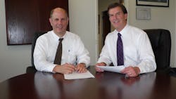 Michael S. Rogers, left, and Dan Prochnow rely on partners to help them fulfill many of the contracts they land with the federal government. Michael S. Rogers, left, and Dan Prochnow rely on partners to help them fulfill many of the contracts they land with the federal government.