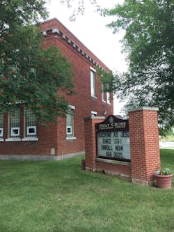 The 130-student campus consists of a church, rectory with administrative offices and private K-8 school all on one large campus in a rural area.