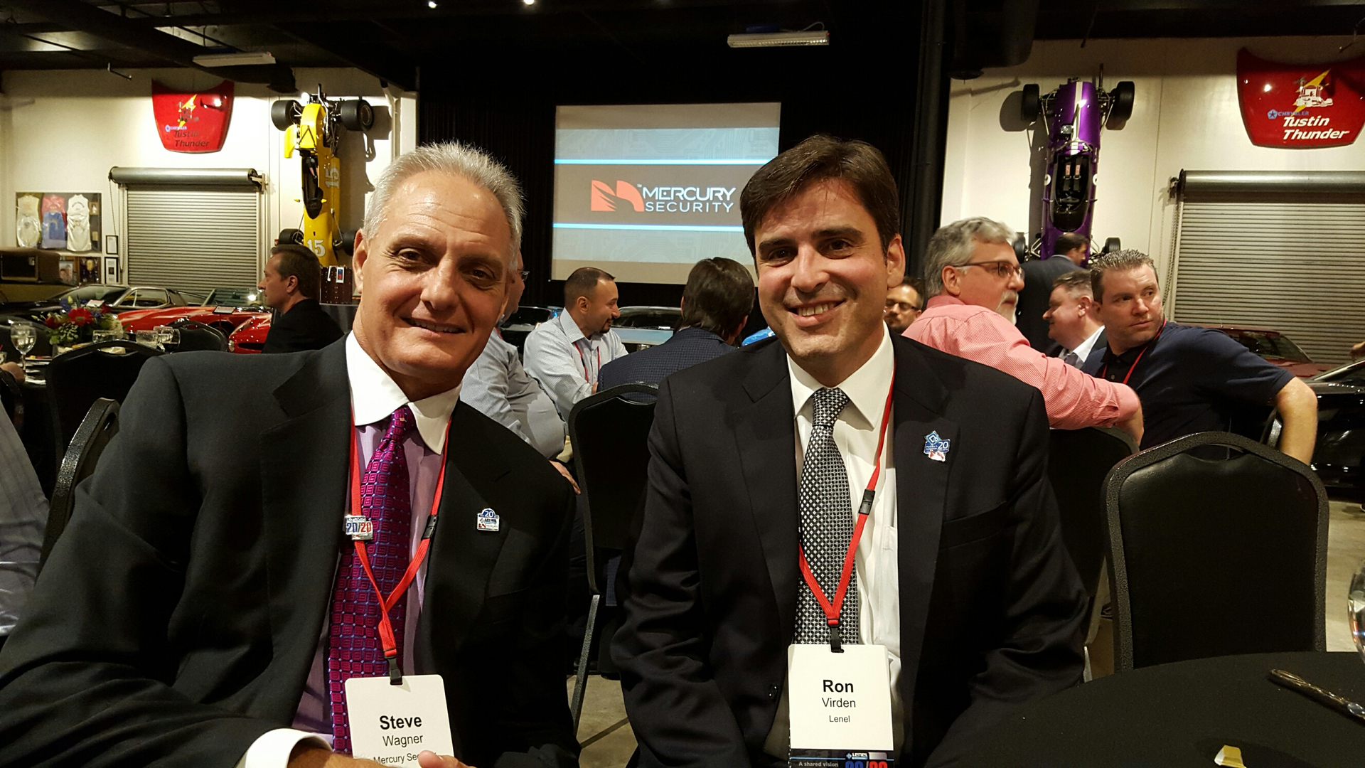 Steve Wagner, President of Mercury and Ron Virden, managing director, electronic access solutions at UTC celebrated 20 years of technology and business collaboration at the Marconi Automotive Museum at ASIS 2015.