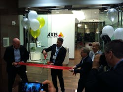 Axis Americas GM Fredrik Nilsson cuts the ribbon on the Axis Experience Center in Irvine, Calif., with the help of facility director Bill Wendlandt (left) and company founder Martin Gren (right). Axis Americas GM Fredrik Nilsson cuts the ribbon on the Axis Experience Center in Irvine, Calif., with the help of facility director Bill Wendlandt (left) and company founder Martin Gren (right).