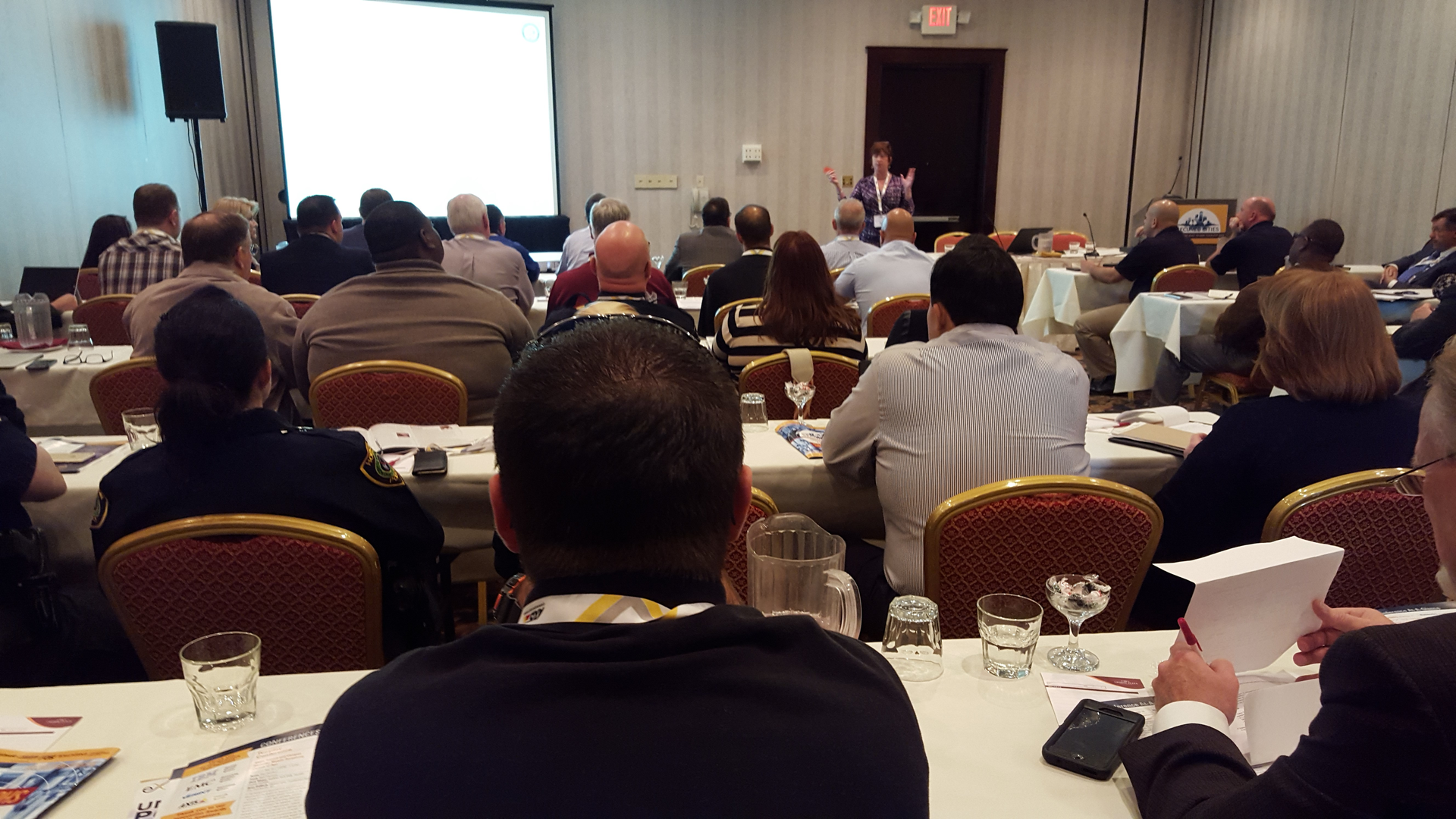 Julie Stroup, with the City of Houston's Mayors Office and DHS, talks to a packed house at 2015 Houston Secured Cities about the video surveillance infrastructure developed by the city and how it has been deployed.