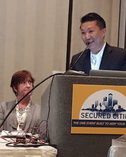 James Chong, president of Vidsys, accepted the Grand Platinum award for the top security project at the Secured Cities Conference. Project Manager Julie Stroup of the City of Houston Mayor’s Office of Public Safety and Homeland Security, looks on. James Chong, president of Vidsys, accepted the Grand Platinum award for the top security project at the Secured Cities Conference. Project Manager Julie Stroup of the City of Houston Mayor’s Office of Public Safety and Homeland Security, looks on.